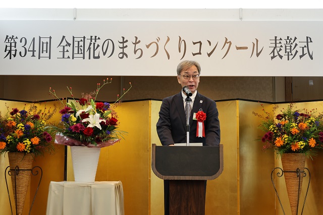 写真：来賓のご祝辞